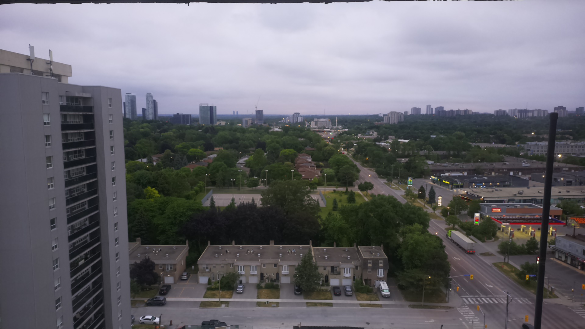 The camera's view at 6 a.m. on its first day: an overcast dawn over trees, townhouses and a tower block